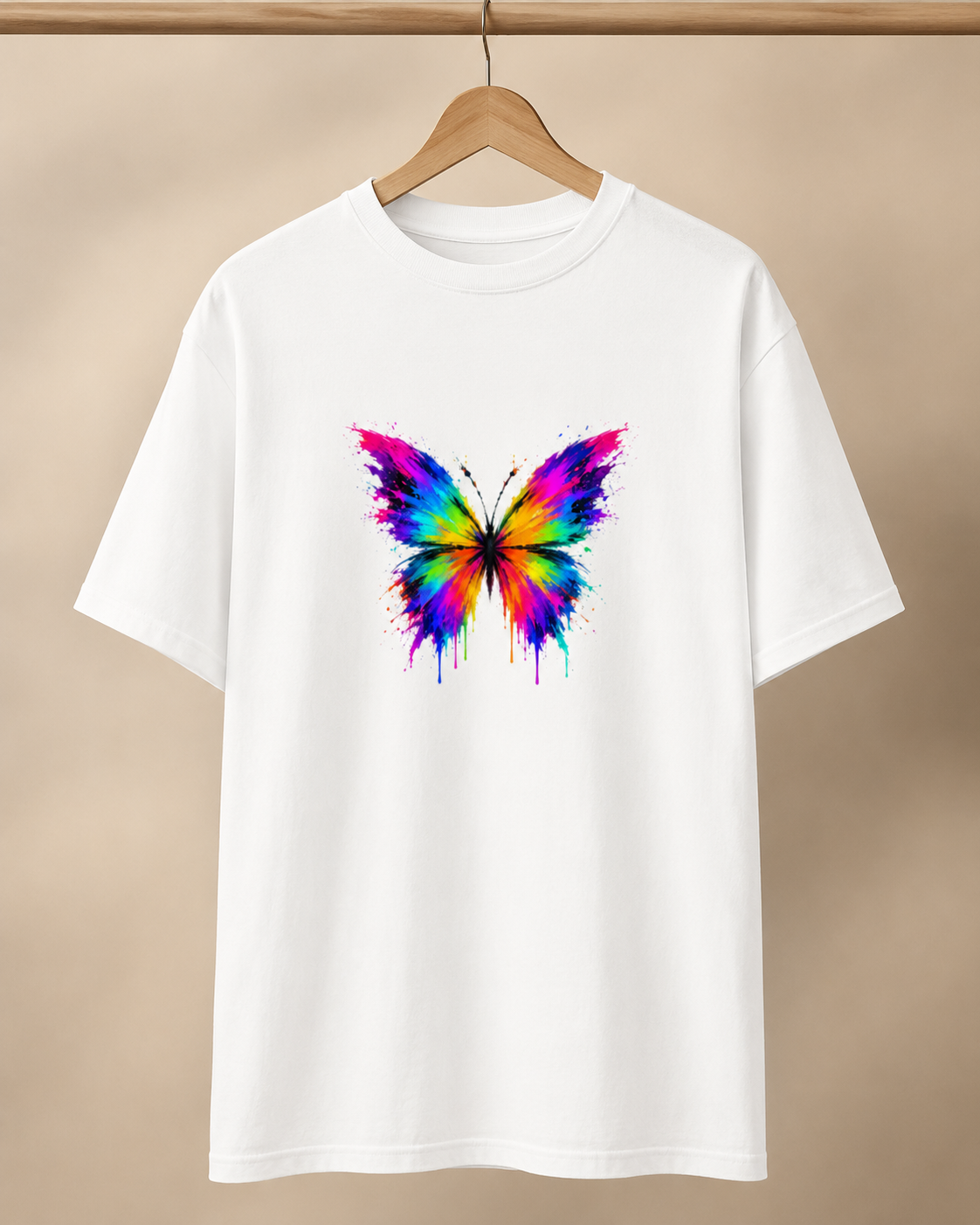White t-shirt with a colorful butterfly design on a beige background