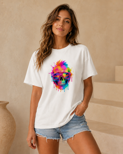 Woman wearing a white t-shirt with a colorful skull design in a room.