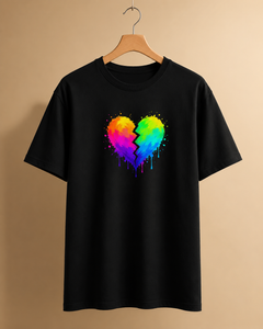 Black t-shirt with a colorful heart design on a beige background
