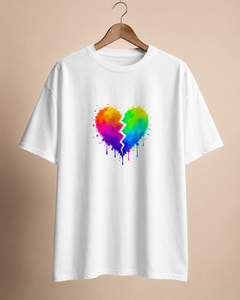 White t-shirt with a colorful broken heart design on a beige background