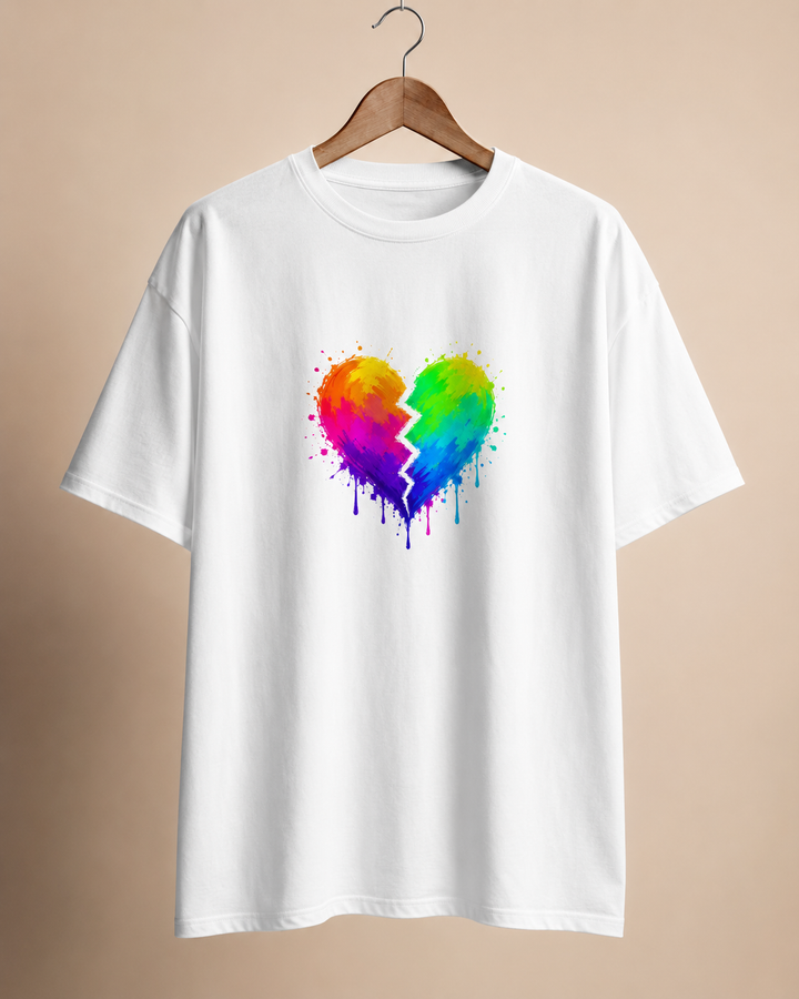 White t-shirt with a colorful broken heart design on a beige background