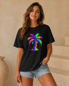 Woman wearing a black t-shirt with a colorful palm tree design in an indoor setting.