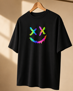 Black t-shirt with a colorful smiley face design on a beige background