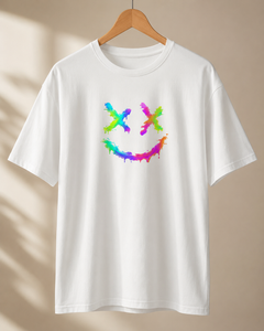 White t-shirt with a colorful smiley face design on a beige background