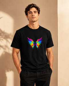 Man wearing a black t-shirt with a colorful butterfly design against a beige background